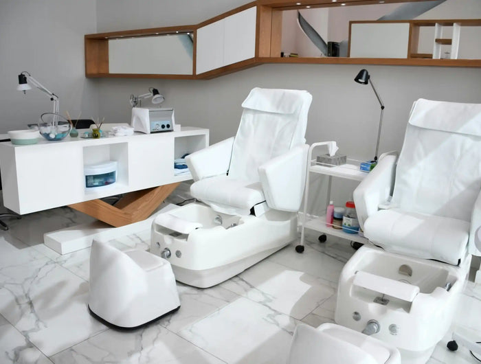 Pedicure chairs with foot baths.